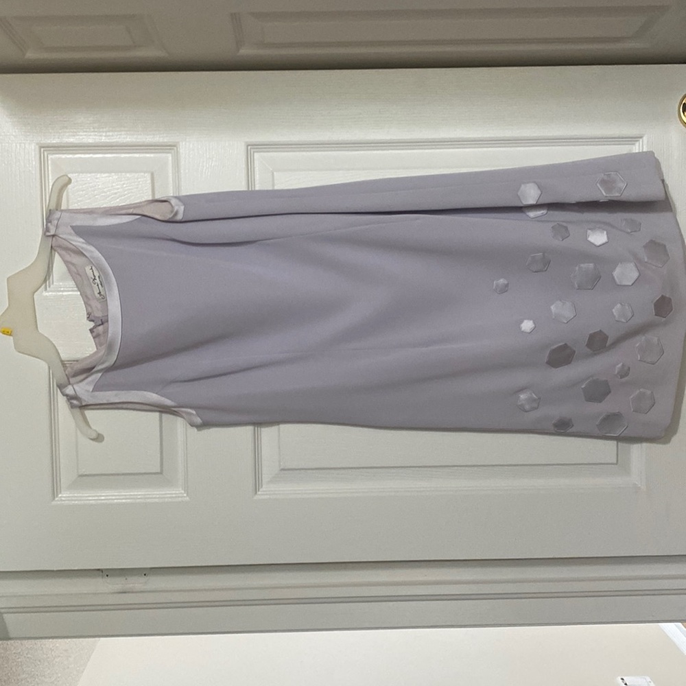 Anne French Creation sleeveless dress with accents.